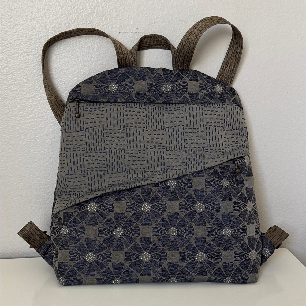 Stylish Backpack. Plenty of room, 11” main area with small interior pocket.